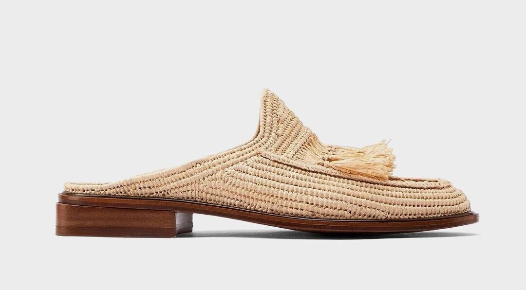 a beautiful piece of handmade raffia shoe, it is a raffia slipper