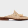 a beautiful piece of handmade raffia shoe, it is a raffia slipper