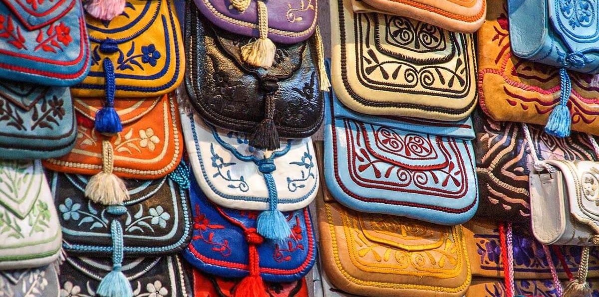 Moroccan leather goods displayed at a bustling market