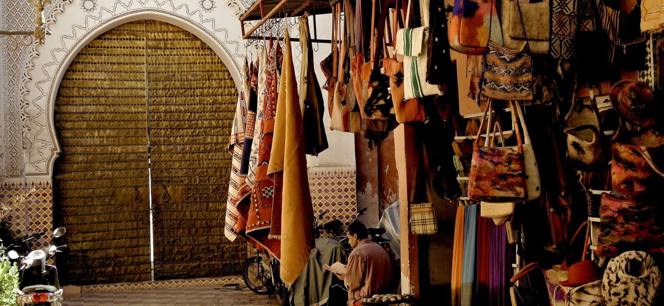 Moroccan handmade leather goods displayed in a vibrant souk