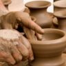 an artisan making pottery