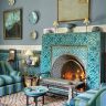 A beautifully decorated Moroccan-inspired living room with leather pouffs and vibrant patterns.