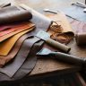 Moroccan leather artisan crafting a wallet - showcasing the artistry of handmade leather goods