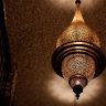 Ornate Moroccan brass lantern with intricate hand-engraved patterns