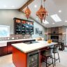 Moroccan brass lantern hanging in a modern kitchen, casting intricate shadows.