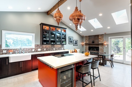 Moroccan brass lantern hanging in a modern kitchen, casting intricate shadows.