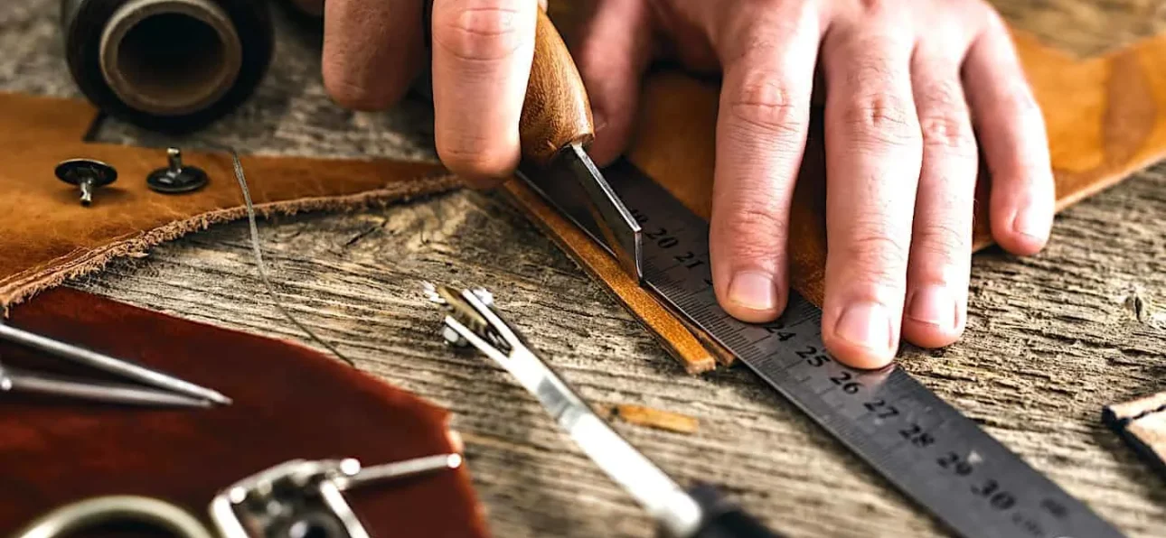 Skilled Moroccan artisans handcrafting leather goods in a traditional workshop