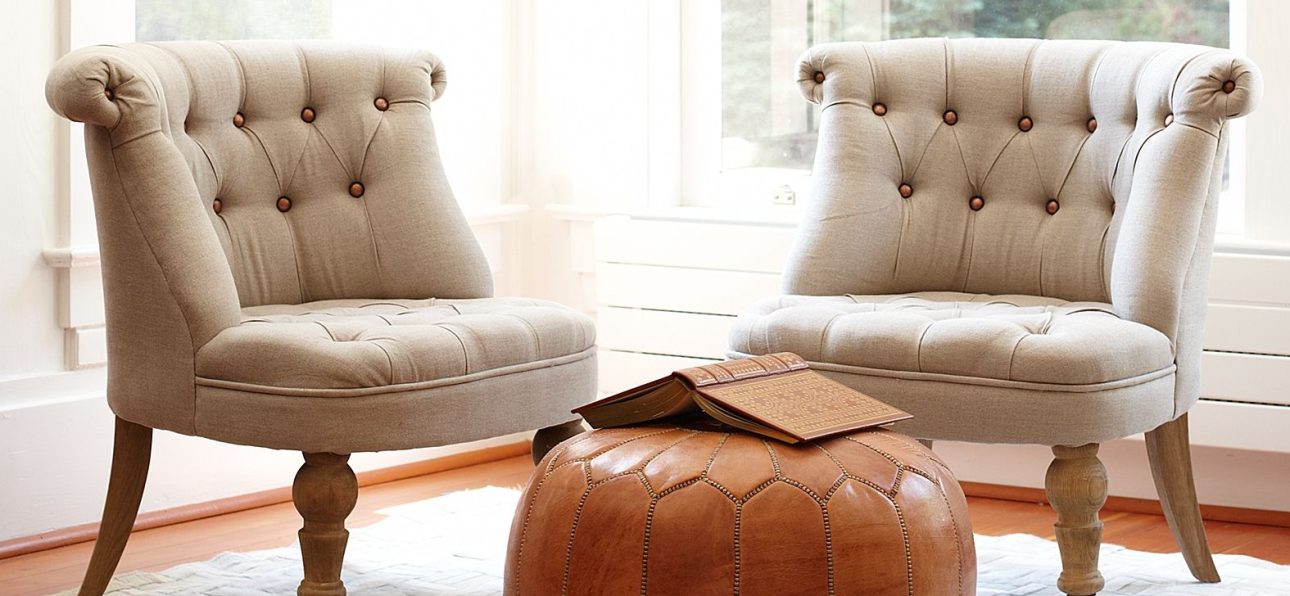 A Moroccan leather pouff adding style to a living room