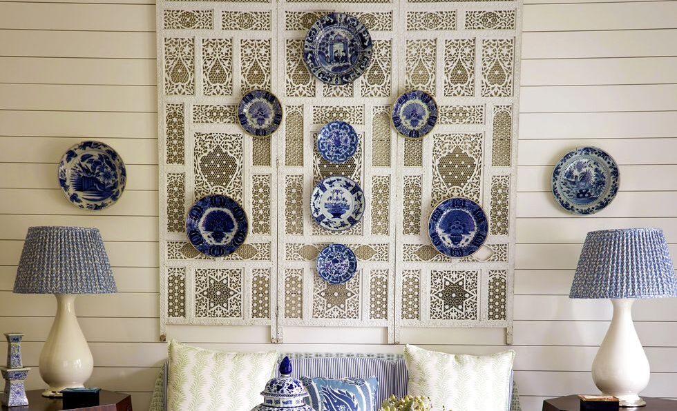 An ornate piece of Moroccan pottery hanging on a living room wall, adding vibrant colors and intricate patterns to the decor