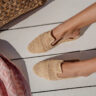 Handcrafted Moroccan Raffia sandal displayed in a stylish interior setting.