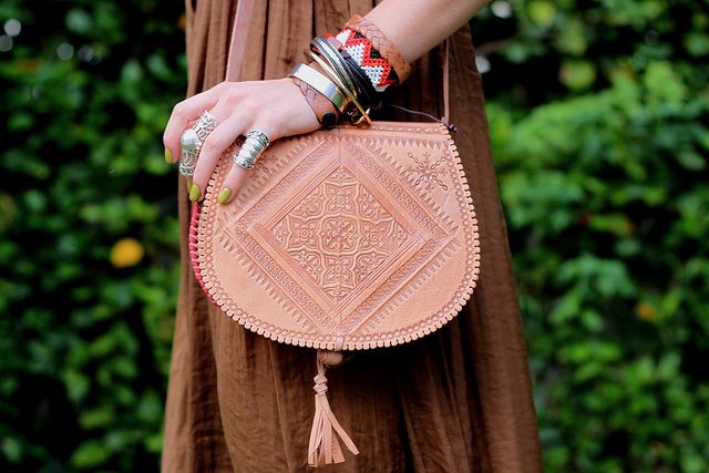 Image featuring a fashionable woman wearing a crossbody leather bag, showcasing a blend of style and functionality.